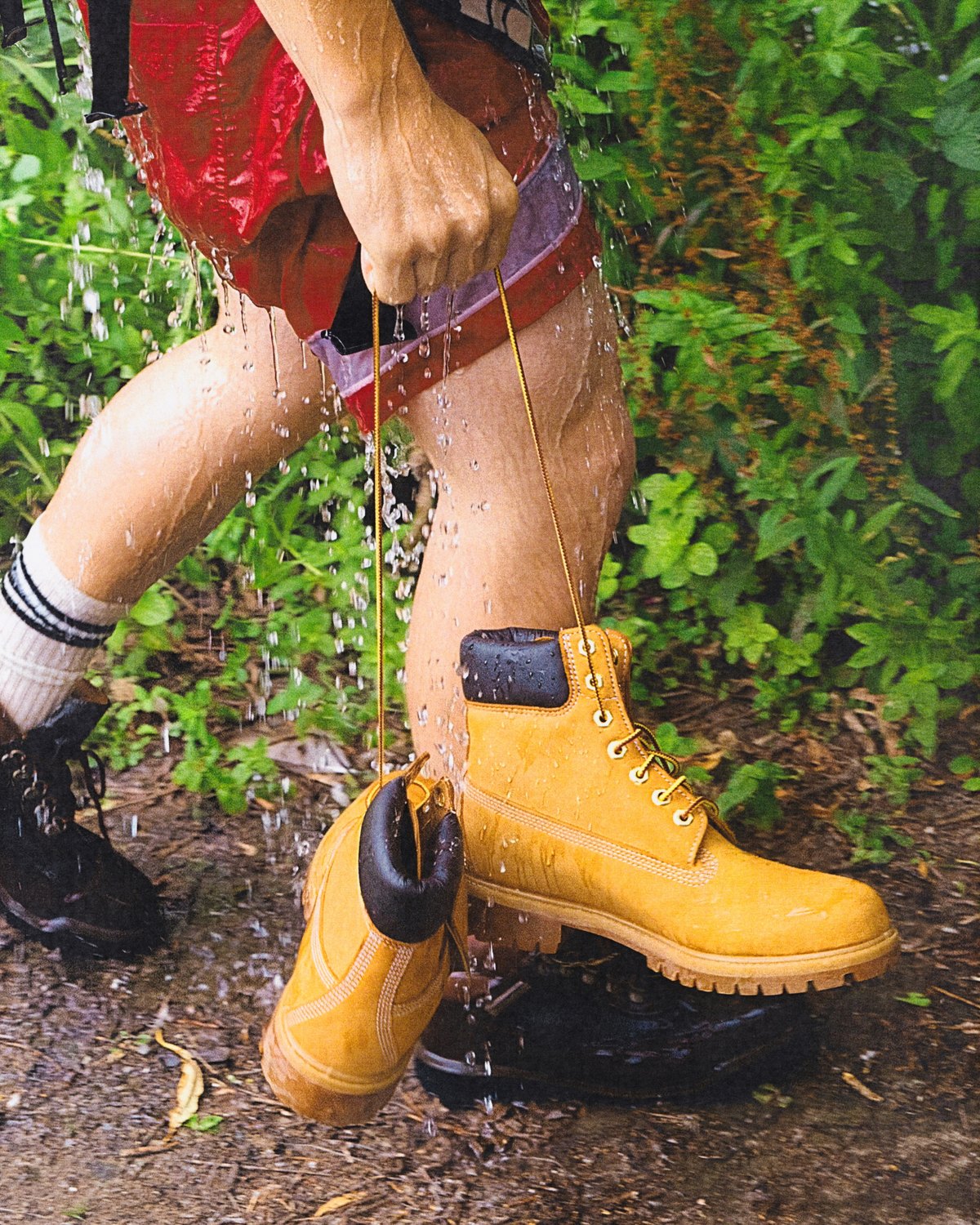 Boots off, crossing the water.